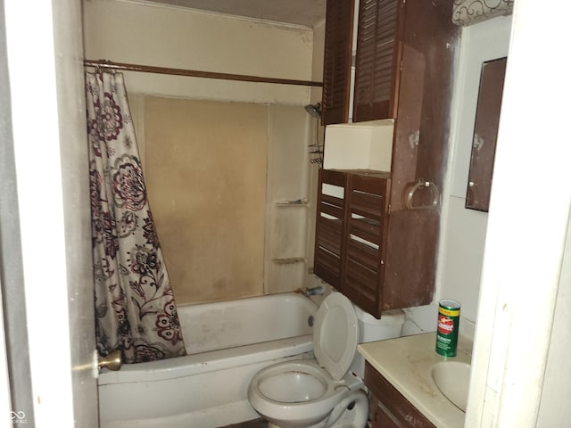 full bathroom featuring shower / tub combo, vanity, and toilet