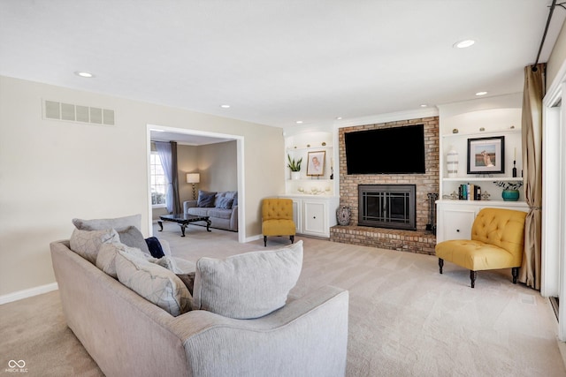 living room featuring light carpet and a brick fireplace