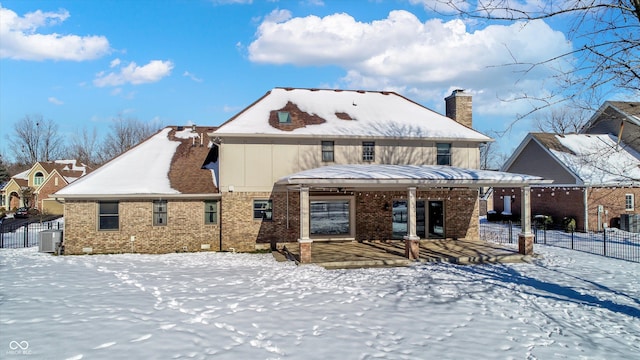 view of front of house featuring a porch and central AC