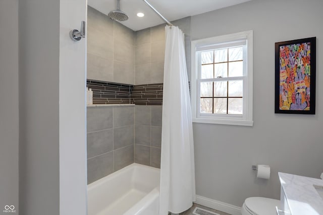 full bathroom featuring toilet, vanity, and shower / bath combination with curtain