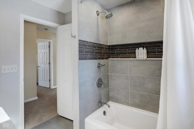 bathroom with tile patterned flooring and shower / tub combo with curtain