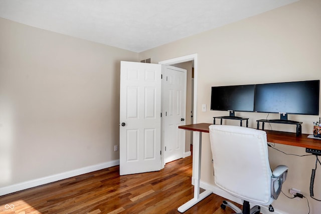 office with dark hardwood / wood-style floors