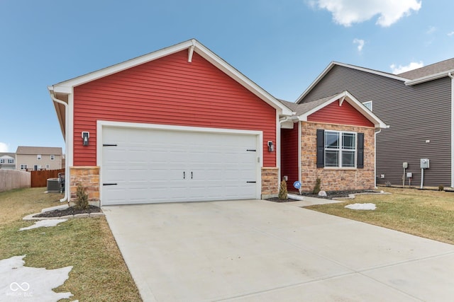 view of front facade with a garage, central AC unit, and a front lawn