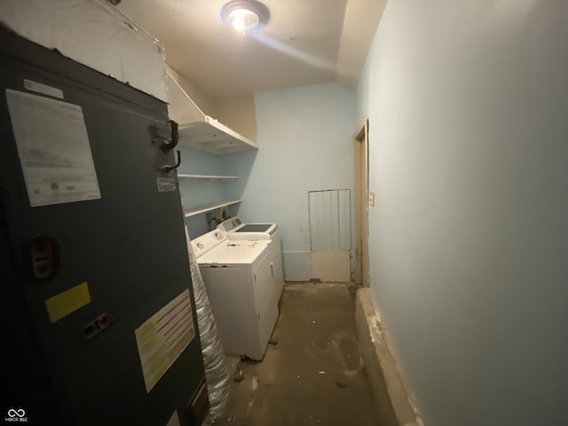 washroom with heating unit and independent washer and dryer