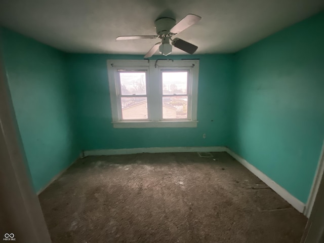 empty room with carpet and ceiling fan