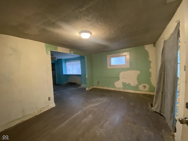 basement featuring a textured ceiling