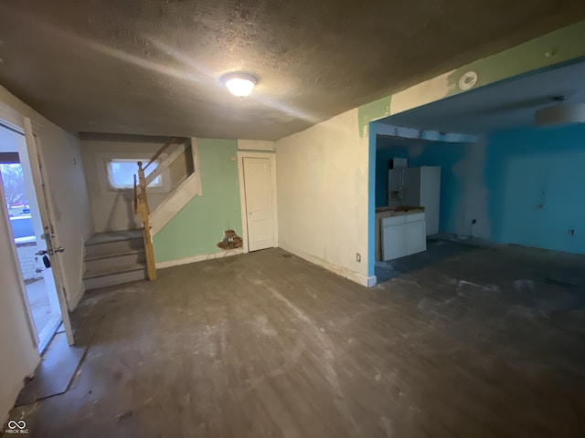 interior space featuring a textured ceiling