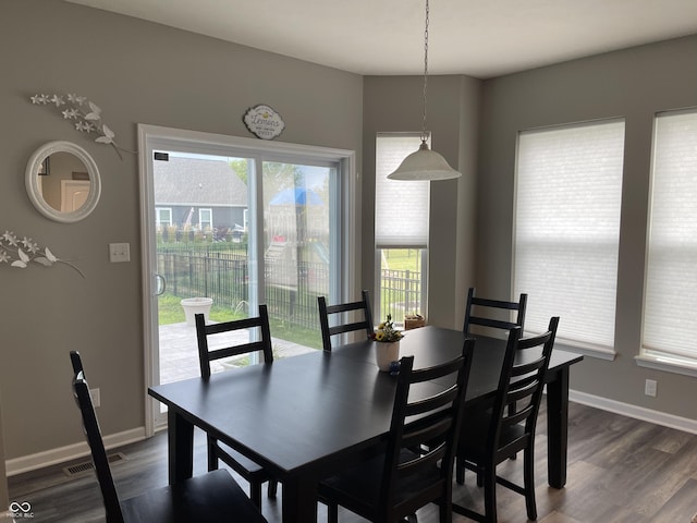 dining area featuring dark hardwood / wood-style floors