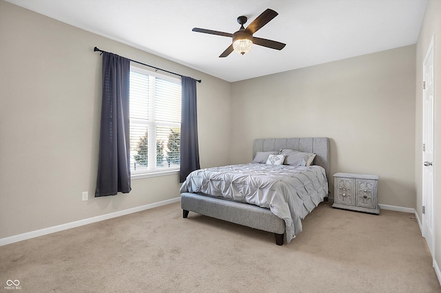 bedroom with light carpet and ceiling fan