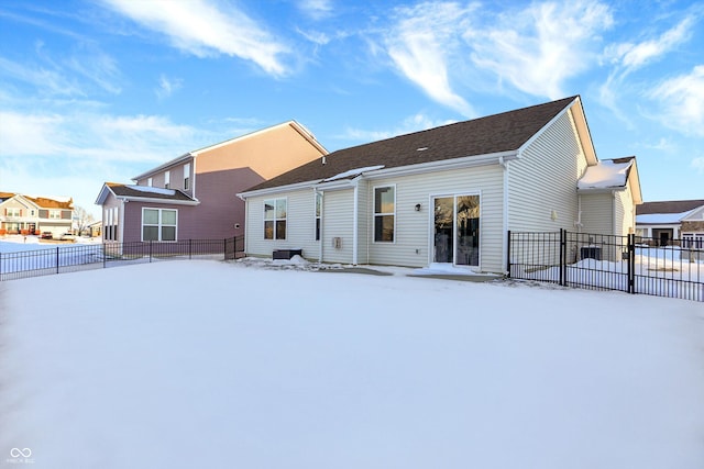 view of snow covered house