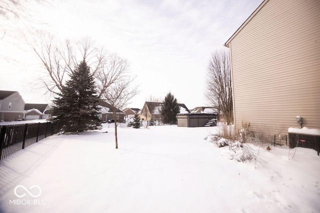 view of yard covered in snow