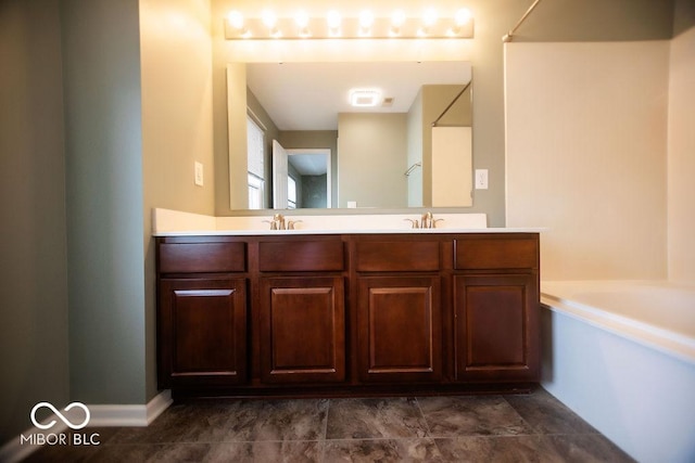 bathroom featuring vanity and a tub to relax in