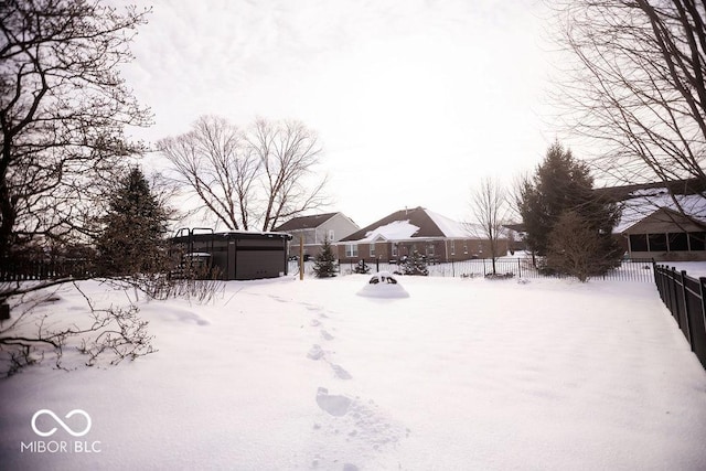 view of yard covered in snow