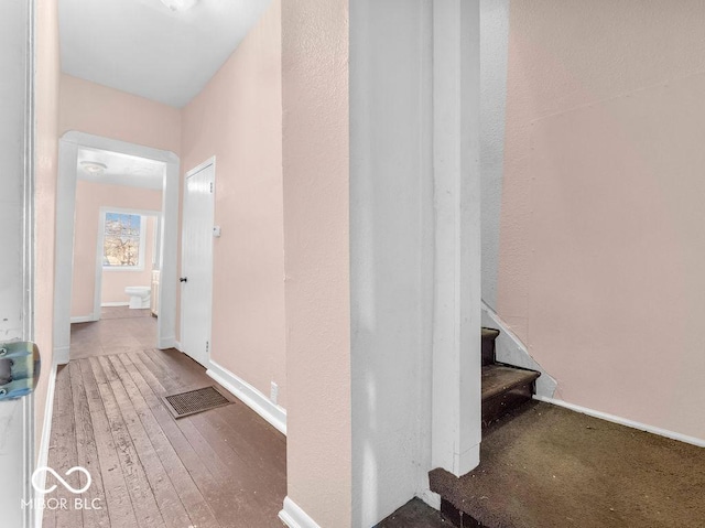 hallway featuring dark hardwood / wood-style floors