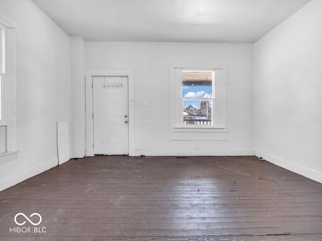 empty room featuring dark hardwood / wood-style floors