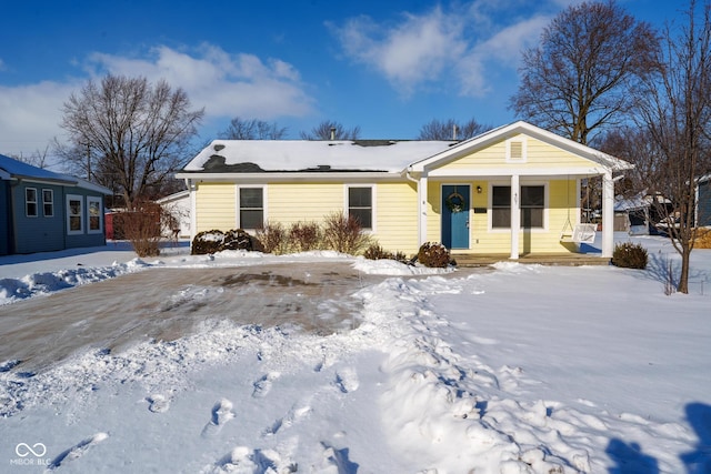 ranch-style home with a porch