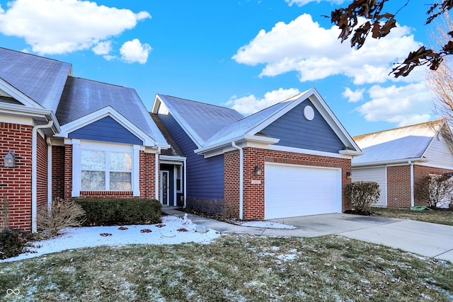 view of front of property featuring a yard and a garage