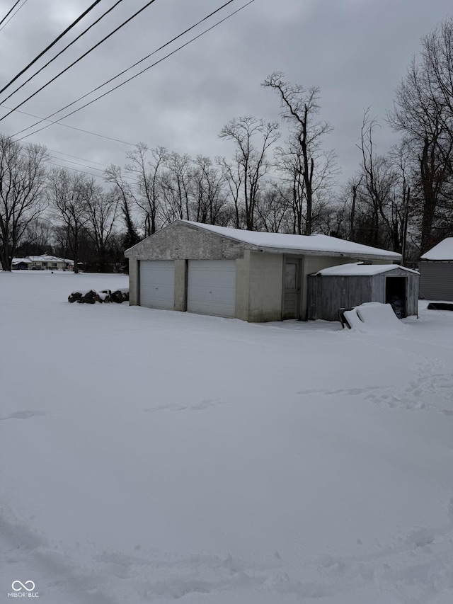 view of snow covered garage