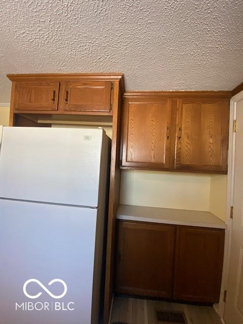 kitchen featuring white fridge