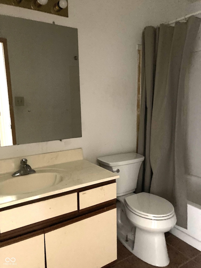 full bathroom featuring tile patterned flooring, vanity, shower / bath combination with curtain, and toilet