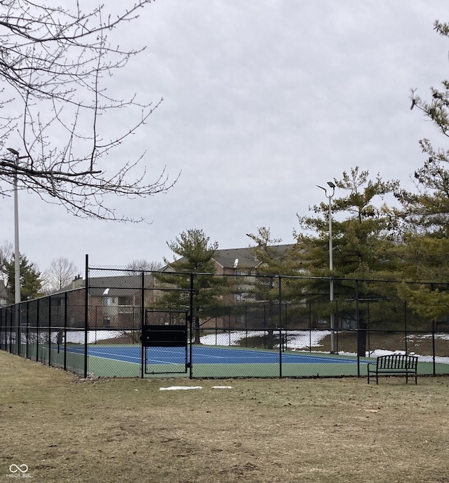 exterior space with tennis court