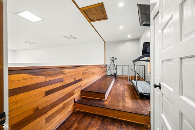 workout room with dark hardwood / wood-style flooring