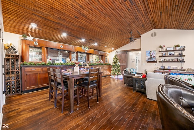 dining area with dark hardwood / wood-style floors, ceiling fan, and lofted ceiling