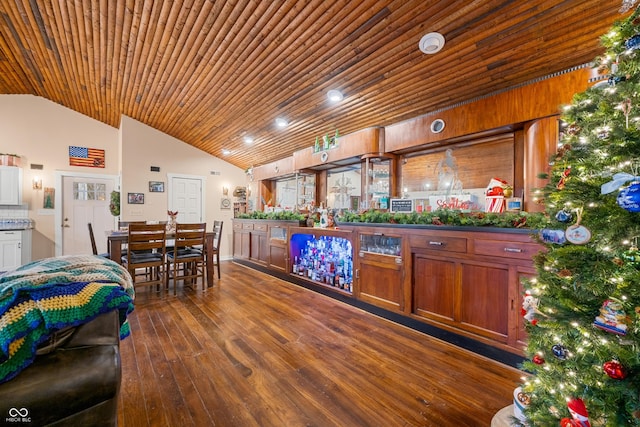 bar featuring wood ceiling, dark wood-type flooring, and lofted ceiling