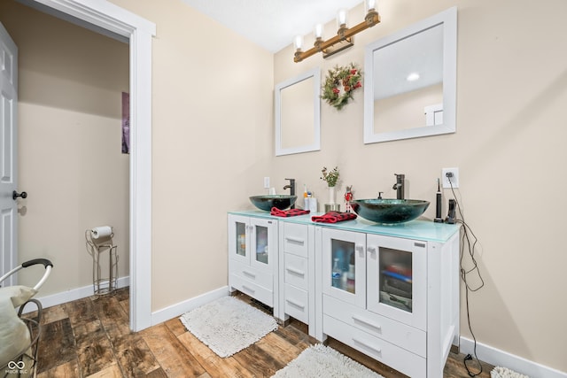 bathroom with vanity and hardwood / wood-style flooring