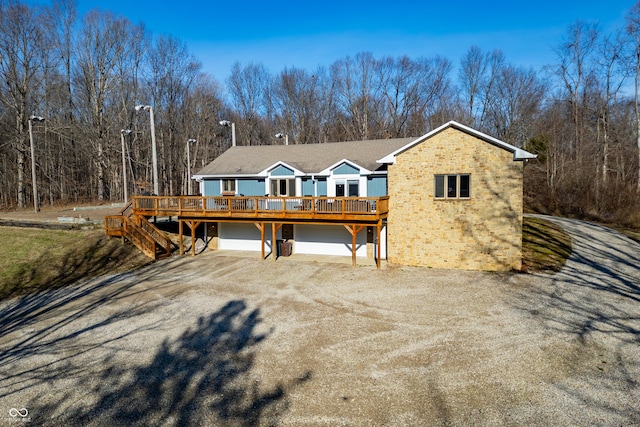 view of front of home featuring a garage and a deck