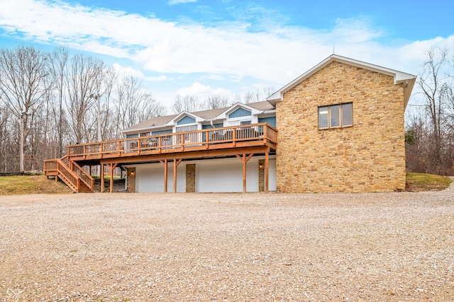 view of front of property with a garage and a deck