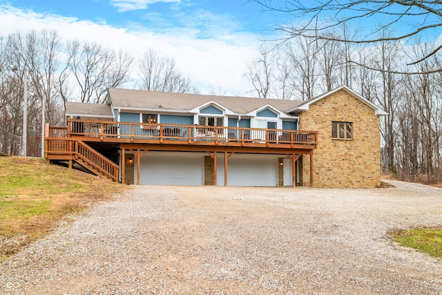 view of front of house featuring a garage and a deck