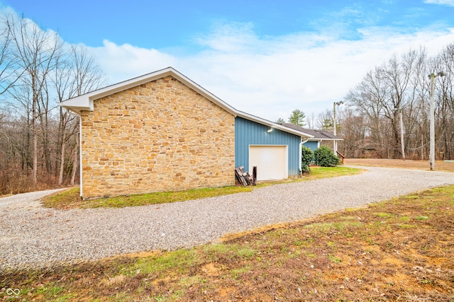 view of side of property with a garage