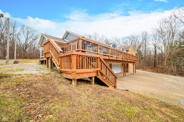 rear view of property featuring a deck