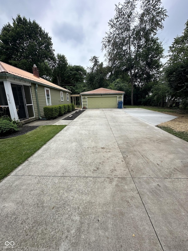 view of property exterior featuring an outbuilding and a garage