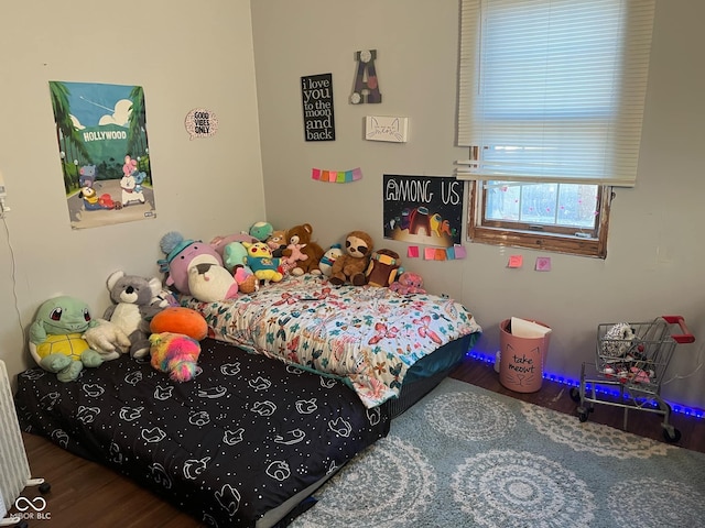 bedroom with wood-type flooring