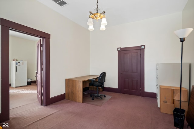 office area with a chandelier and carpet flooring