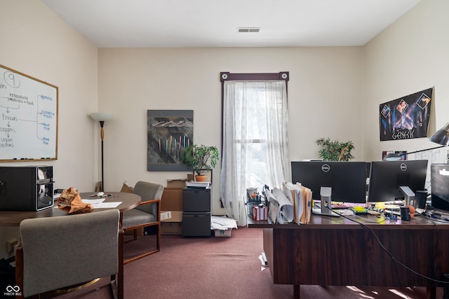 office area featuring dark colored carpet