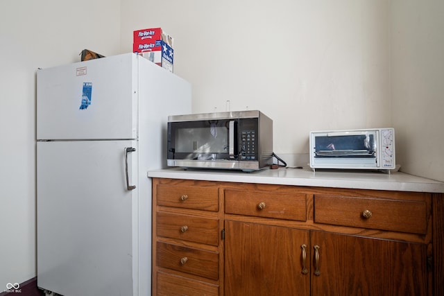 kitchen featuring white refrigerator