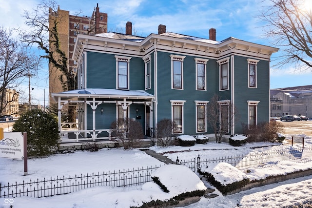 italianate home featuring covered porch