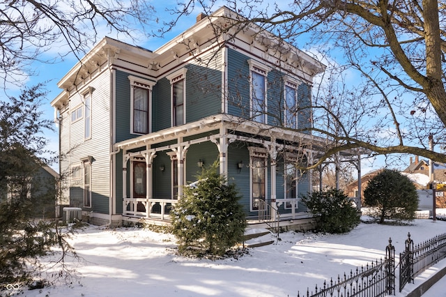 italianate house with central AC and a porch