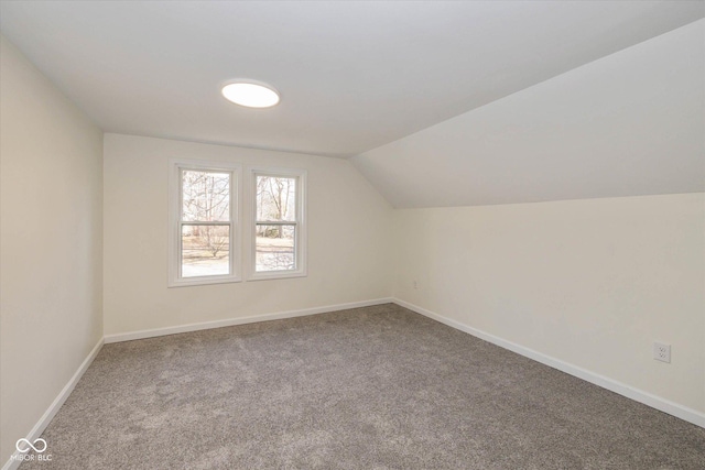 bonus room featuring lofted ceiling and carpet floors