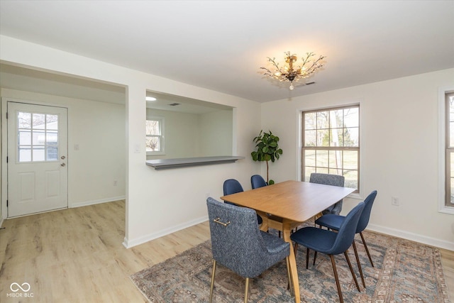 dining area with light hardwood / wood-style floors