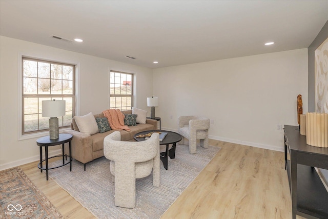 living room with light hardwood / wood-style floors