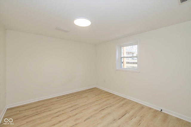 spare room featuring light wood-type flooring