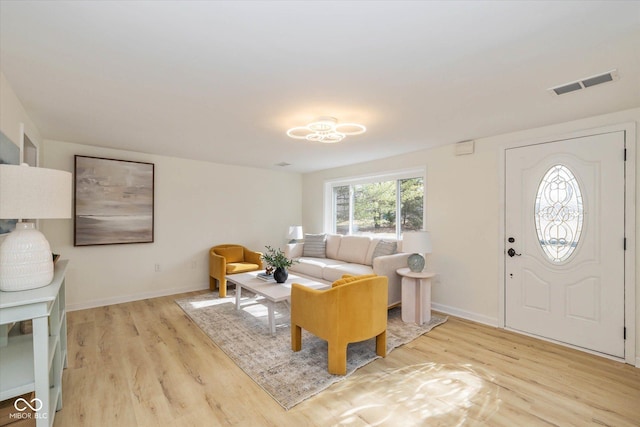 entryway with light hardwood / wood-style floors