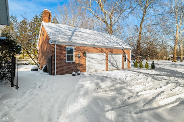 view of snow covered garage