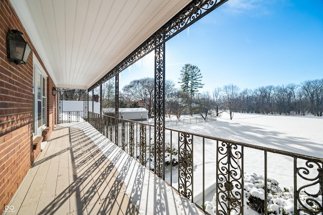 view of snow covered deck