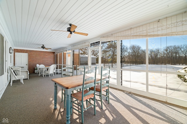 sunroom featuring ceiling fan