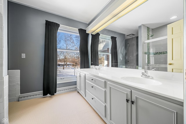 bathroom featuring vanity and a shower with shower door